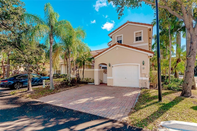 1094 Redwood St ., Unit Hollywood, FL 33019 - mediterranean / spanish house with stucco siding, a tiled roof, and decorative driveway