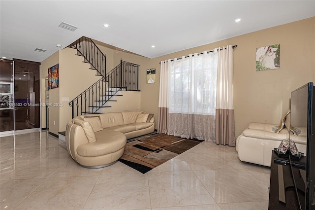 1094 Redwood St ., Unit Hollywood, FL 33019 - living area featuring marble finish floor, recessed lighting, visible vents, and stairway