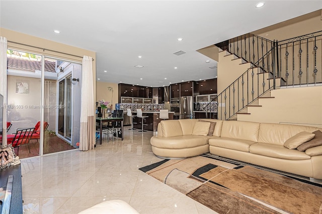 1094 Redwood St ., Unit Hollywood, FL 33019 - living area featuring recessed lighting, visible vents, marble finish floor, and stairs