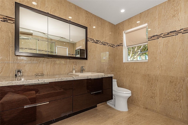 1094 Redwood St ., Unit Hollywood, FL 33019 - bathroom featuring vanity, tile walls, walk in shower, toilet, and marble finish floor