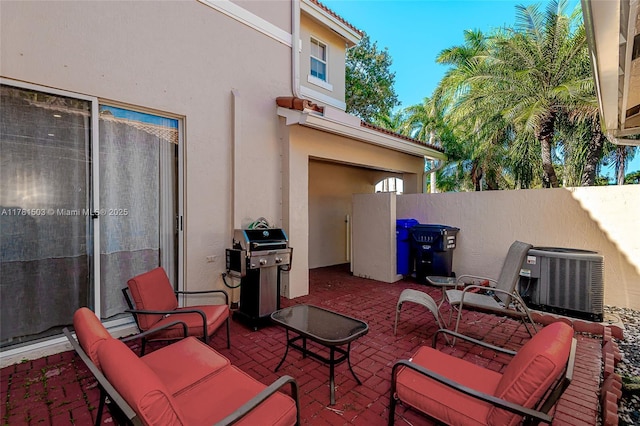 1094 Redwood St ., Unit Hollywood, FL 33019 - view of patio / terrace with a grill, cooling unit, and fence