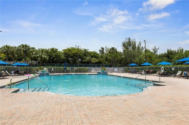 1094 Redwood St ., Unit Hollywood, FL 33019 - community pool featuring a patio area and fence