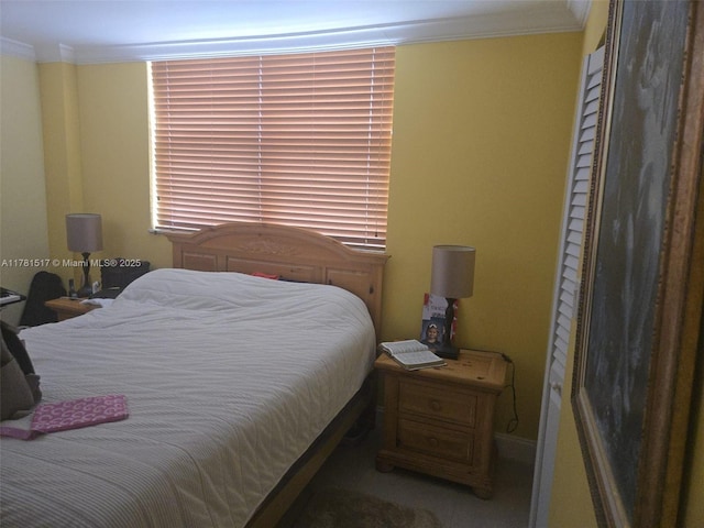 bedroom with ornamental molding