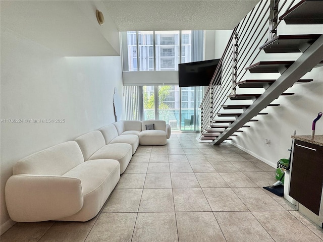 living area featuring light tile patterned floors and visible vents