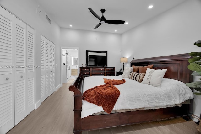 bedroom with baseboards, recessed lighting, visible vents, ceiling fan, and wood finished floors