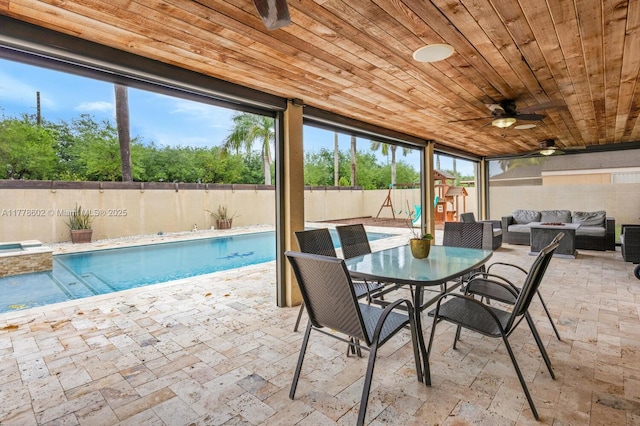 exterior space featuring ceiling fan, an outdoor hangout area, a fenced backyard, a patio, and outdoor dining space