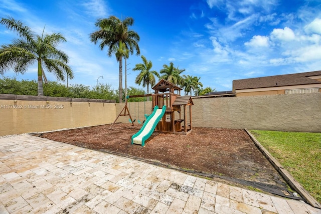 view of play area with a fenced backyard