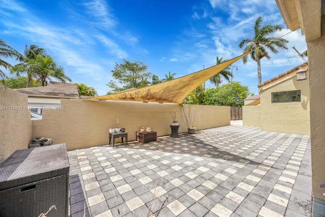view of patio / terrace featuring fence