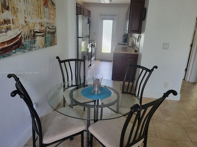 1001 SE 14th Pl Unit 2A, Fort Lauderdale, FL 33316 - dining space featuring baseboards and light tile patterned flooring