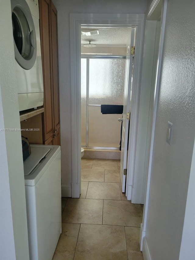 1001 SE 14th Pl Unit 2A, Fort Lauderdale, FL 33316 - laundry room featuring light tile patterned floors, washer / dryer, and cabinet space