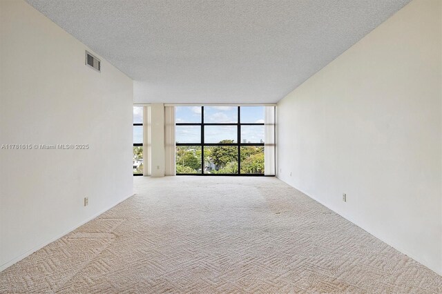 600 Parkview Dr Unit 625, Hallandale Beach, FL 33009 - unfurnished room with light carpet, visible vents, and a textured ceiling