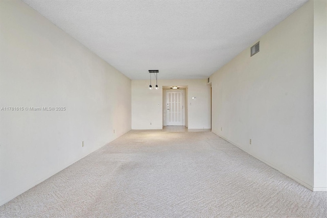 600 Parkview Dr Unit 625, Hallandale Beach, FL 33009 - unfurnished room with visible vents, light colored carpet, and a textured ceiling