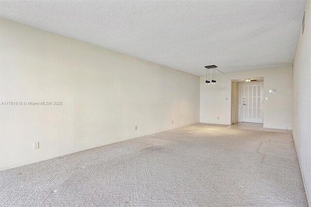600 Parkview Dr Unit 625, Hallandale Beach, FL 33009 - unfurnished room featuring a textured ceiling and light colored carpet
