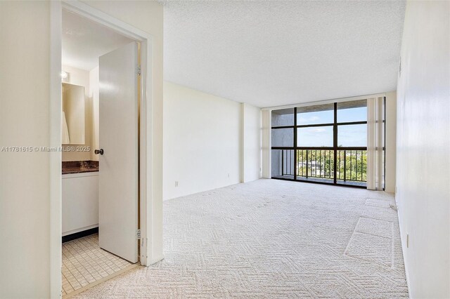 600 Parkview Dr Unit 625, Hallandale Beach, FL 33009 - kitchen featuring a sink, white appliances, white cabinetry, and light countertops