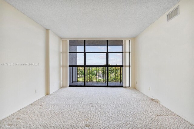 600 Parkview Dr Unit 625, Hallandale Beach, FL 33009 - spare room with carpet floors, a textured ceiling, visible vents, and expansive windows