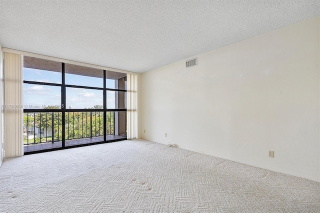 600 Parkview Dr Unit 625, Hallandale Beach, FL 33009 - carpeted spare room featuring visible vents, a textured ceiling, and expansive windows