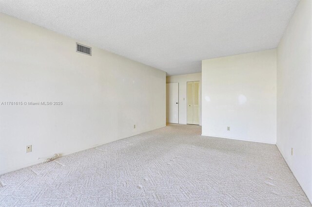 600 Parkview Dr Unit 625, Hallandale Beach, FL 33009 - unfurnished room with carpet and a textured ceiling