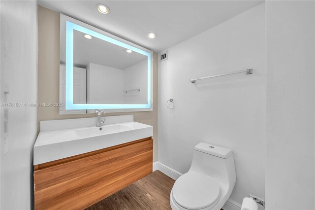 6770 Indian Creek Dr Unit 9G, Miami Beach, FL 33141 - bathroom with vanity, recessed lighting, and wood finished floors