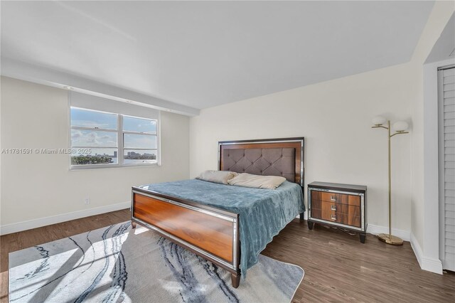 6770 Indian Creek Dr Unit 9G, Miami Beach, FL 33141 - bedroom with baseboards and wood finished floors