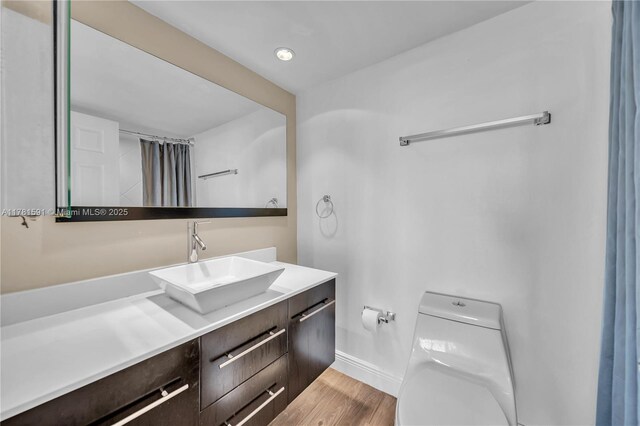 6770 Indian Creek Dr Unit 9G, Miami Beach, FL 33141 - bathroom featuring vanity and wood finished floors
