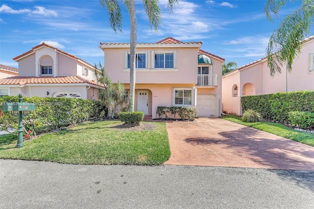 1163 SE 6th Ct, Dania Beach, FL 33004 - mediterranean / spanish-style house with a balcony, concrete driveway, a tile roof, a garage, and stucco siding