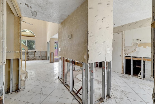1163 SE 6th Ct, Dania Beach, FL 33004 - hallway featuring a towering ceiling and a textured ceiling