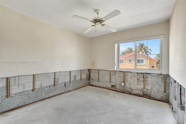 1163 SE 6th Ct, Dania Beach, FL 33004 - spare room featuring concrete floors, ceiling fan, and a textured ceiling