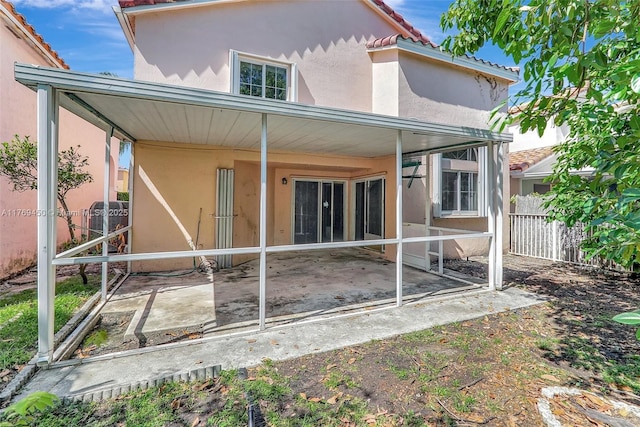 1163 SE 6th Ct, Dania Beach, FL 33004 - back of house featuring a patio, stucco siding, and a tile roof