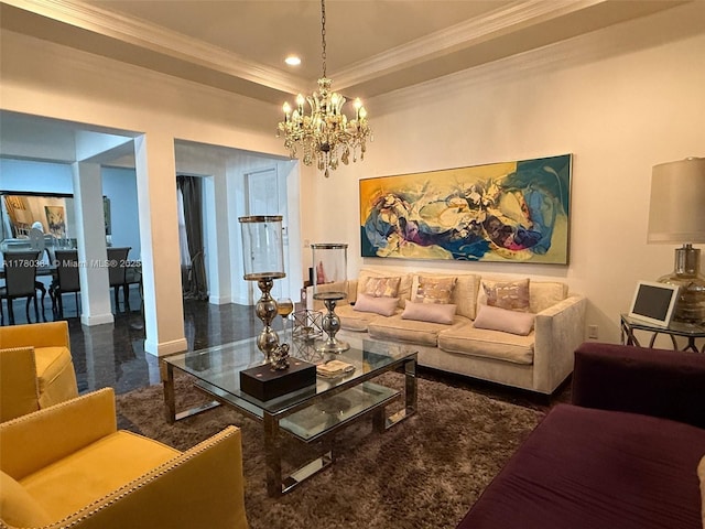 living room with a chandelier, crown molding, a raised ceiling, and baseboards