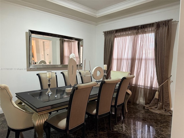 dining space featuring marble finish floor and ornamental molding