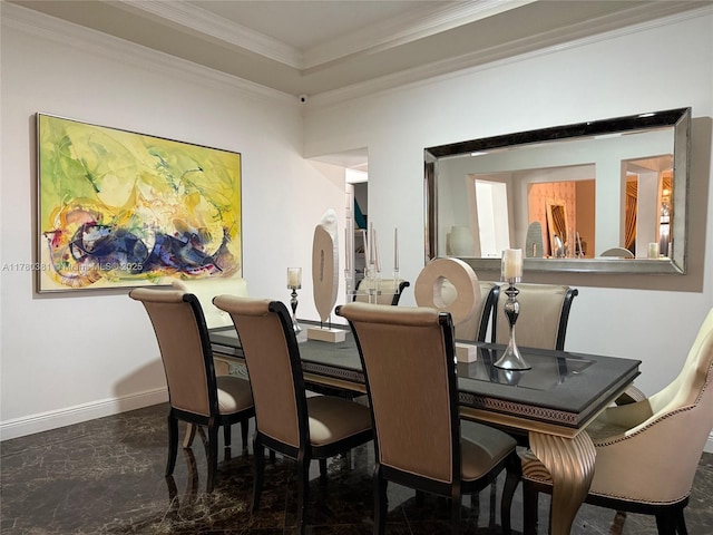dining room featuring ornamental molding and baseboards