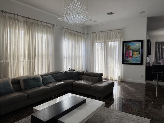 living area featuring visible vents, baseboards, marble finish floor, and a textured ceiling
