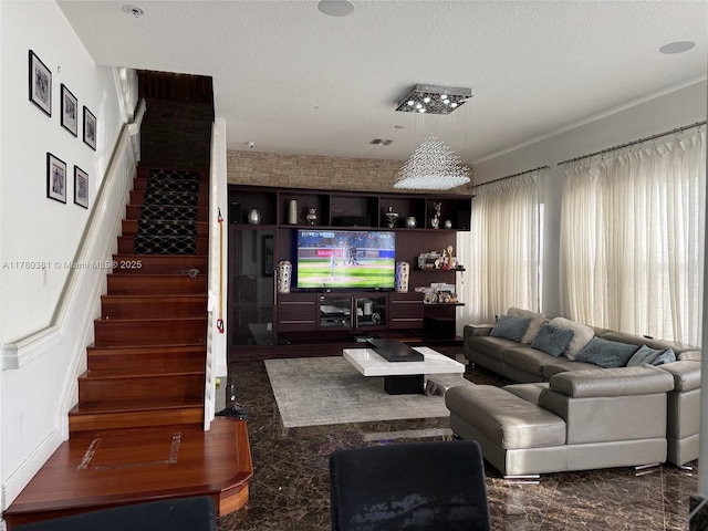 living room with stairs, visible vents, and a textured ceiling