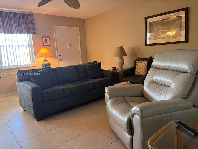 living area featuring light tile patterned floors and a ceiling fan