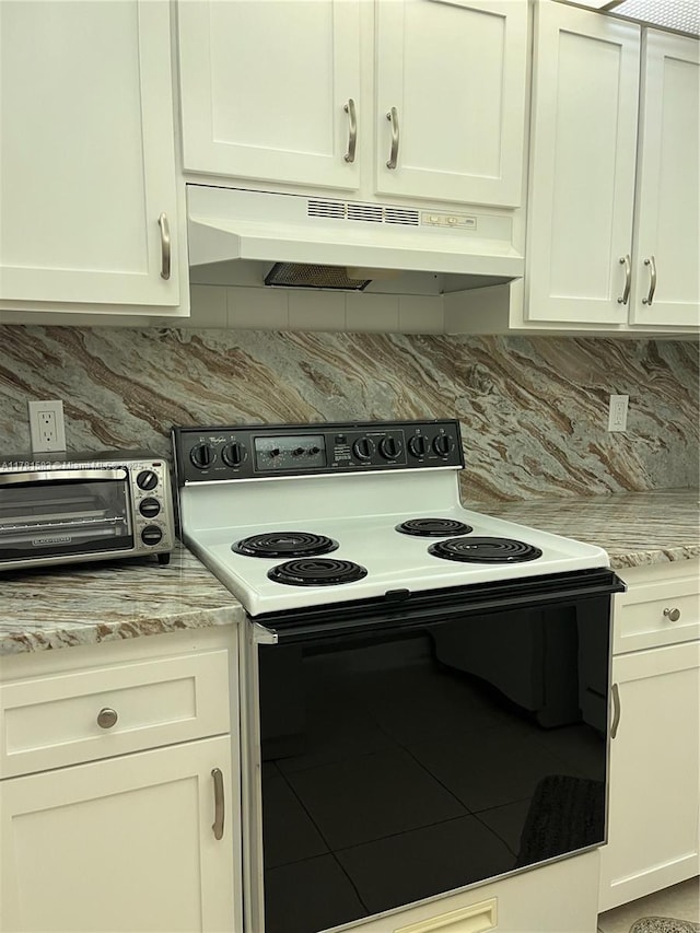 kitchen featuring white cabinets, electric range, under cabinet range hood, backsplash, and a toaster