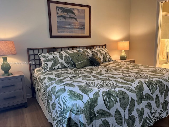 bedroom with wood finished floors