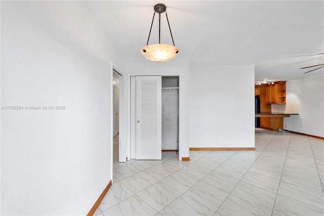 5300 Adams St, Hollywood, FL 33021 - unfurnished dining area featuring baseboards