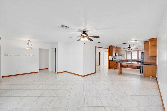 5300 Adams St, Hollywood, FL 33021 - unfurnished living room with ceiling fan and baseboards