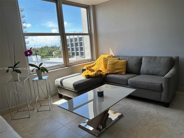 2899 Collins Ave Unit 708, Miami Beach, FL 33140 - living room featuring tile patterned flooring and baseboards