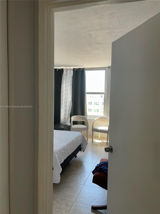 2899 Collins Ave Unit 708, Miami Beach, FL 33140 - bedroom with tile patterned flooring