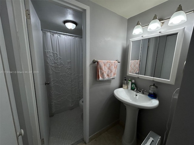 2899 Collins Ave Unit 708, Miami Beach, FL 33140 - bathroom featuring a shower with curtain and tile patterned flooring