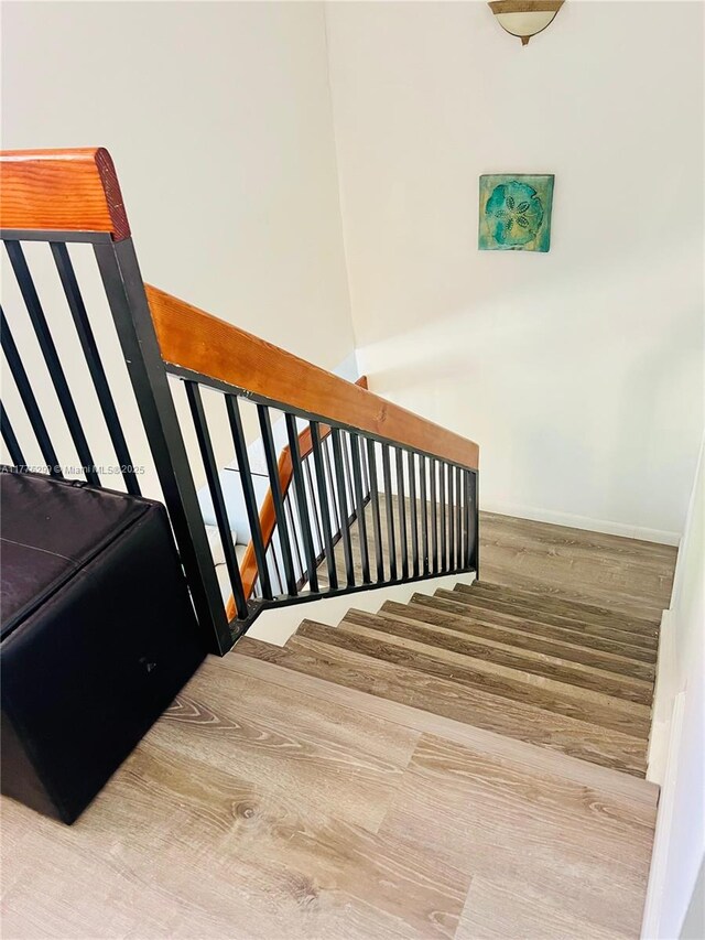 225 Lakeside Cir, Sunrise, FL 33326 - stairway with baseboards and wood finished floors