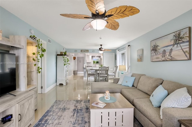 living area with visible vents and a ceiling fan