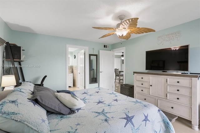 bedroom featuring visible vents, connected bathroom, and ceiling fan