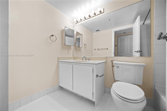 bathroom with tile patterned floors, vanity, visible vents, and toilet