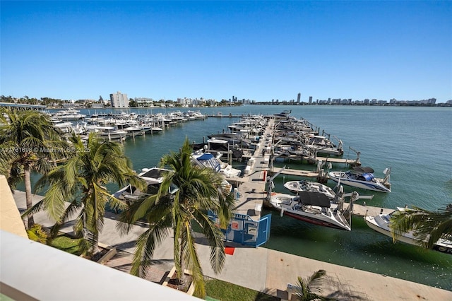 water view featuring a city view, boat lift, and a dock