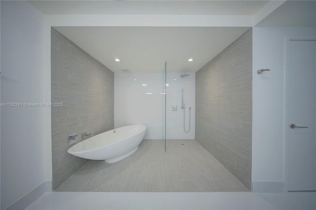 300 Sunny Isles Blvd Unit 4-1904, Sunny Isles Beach, FL 33160 - bathroom with tile walls, a freestanding tub, and a walk in shower