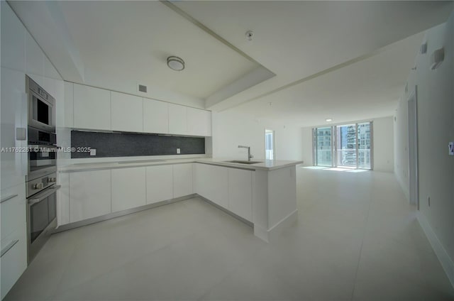 300 Sunny Isles Blvd Unit 4-1904, Sunny Isles Beach, FL 33160 - kitchen with a sink, modern cabinets, open floor plan, and white cabinetry