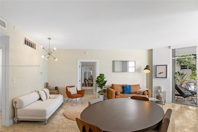 1 Century Ln Unit 309, Miami Beach, FL 33139 - living room featuring a chandelier, baseboards, and visible vents