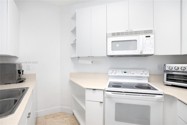 1 Century Ln Unit 309, Miami Beach, FL 33139 - kitchen with white appliances, white cabinetry, baseboards, and open shelves